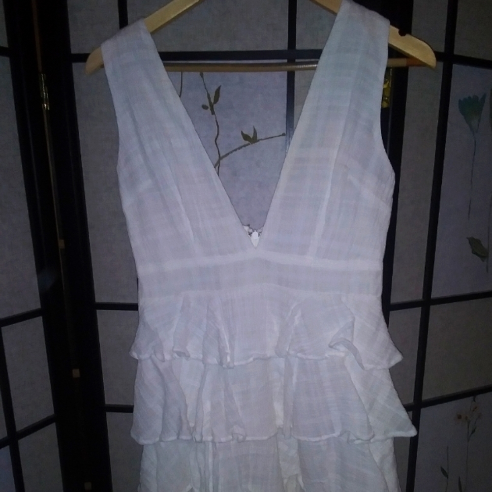 White belted dress with plunging neckline and back, layered skirt above
